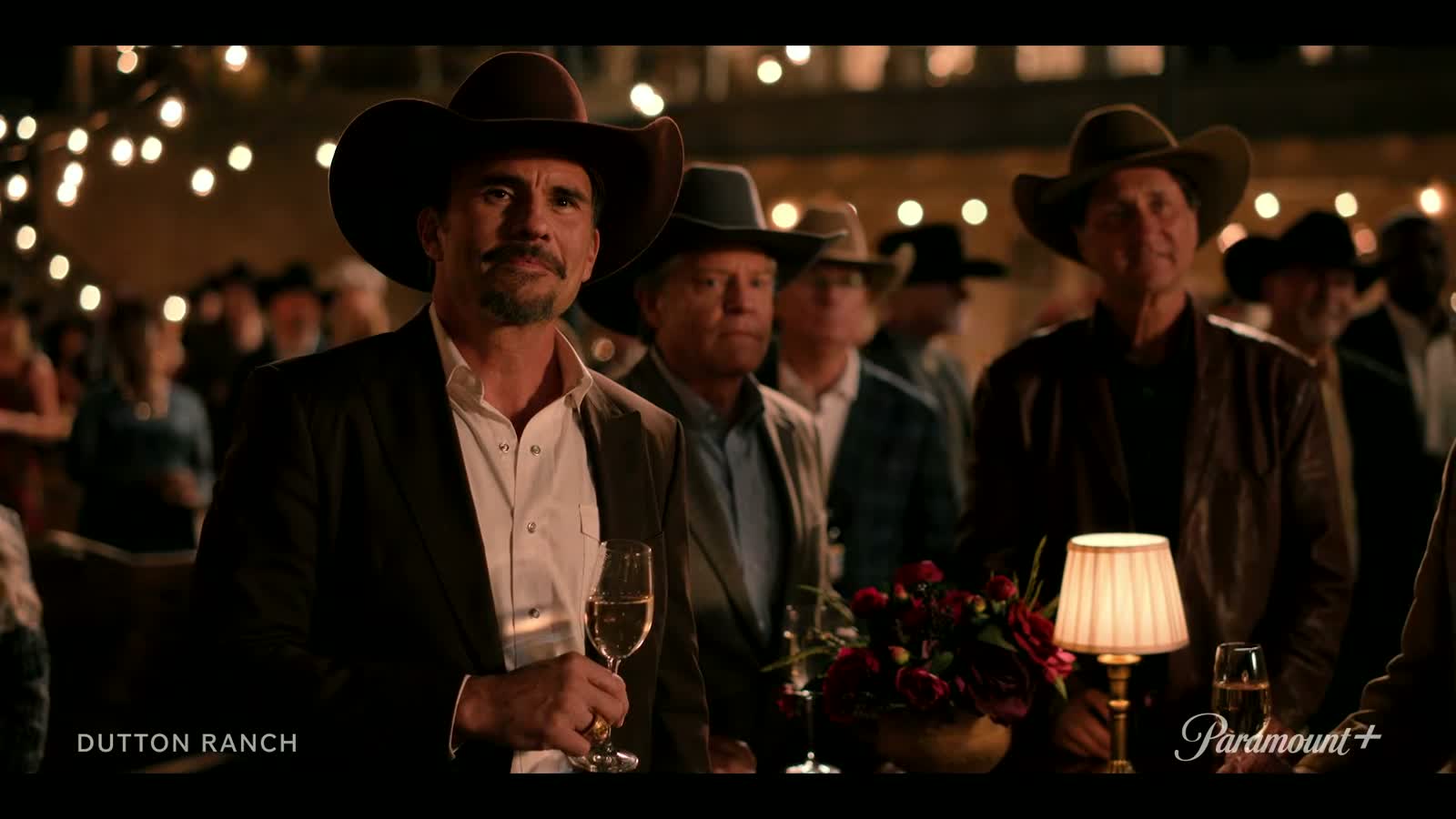 Rob-Will watches the 10 Petal anniversary party in Dutton Ranch Episode 7.